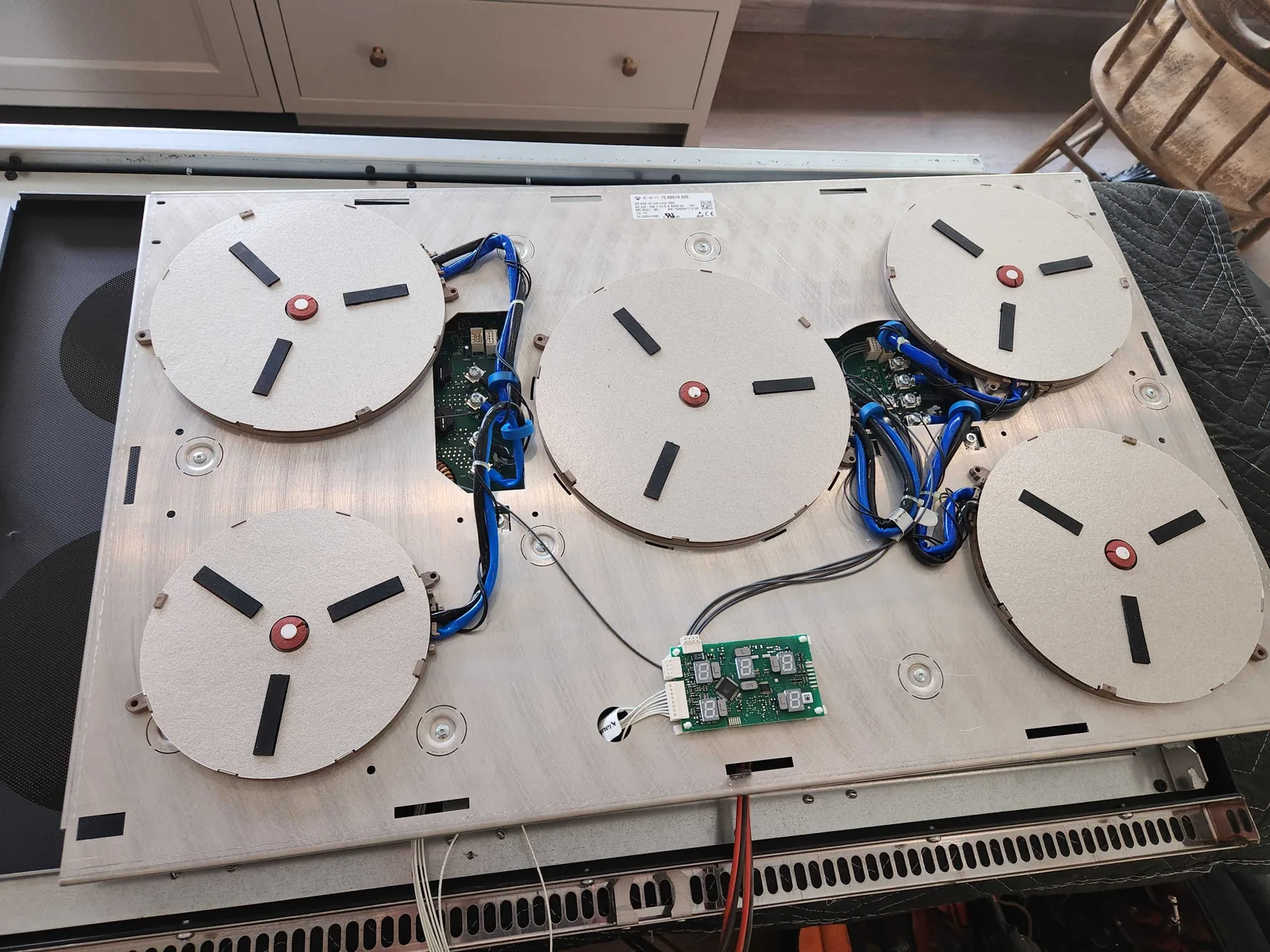 Induction cooking assembly from an AGA range during service.