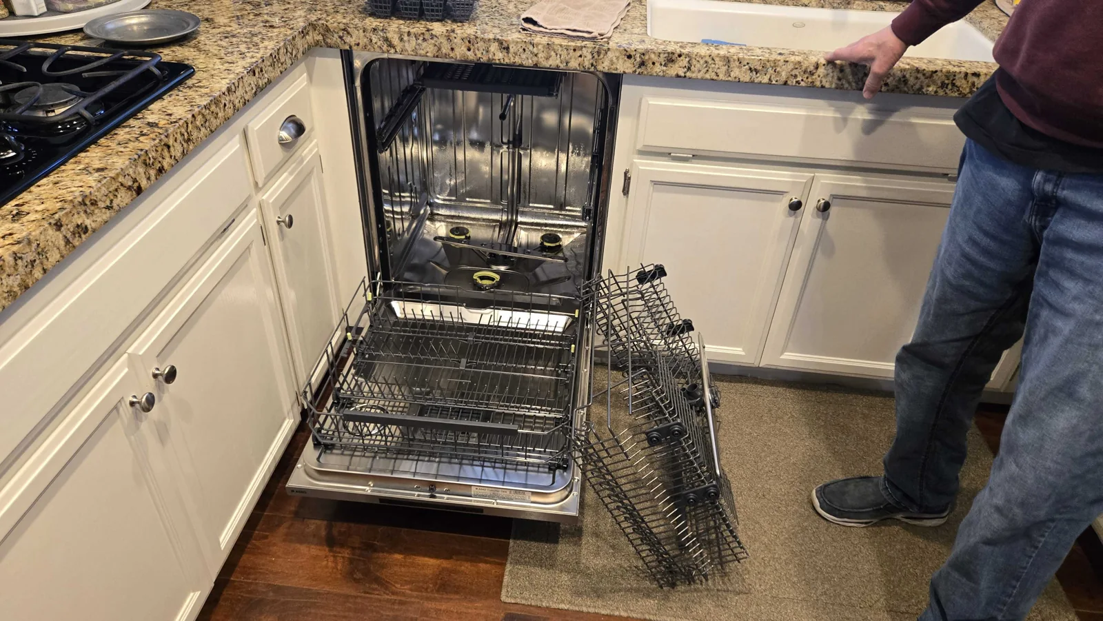 ASKO dishwasher with the door and racks open.
