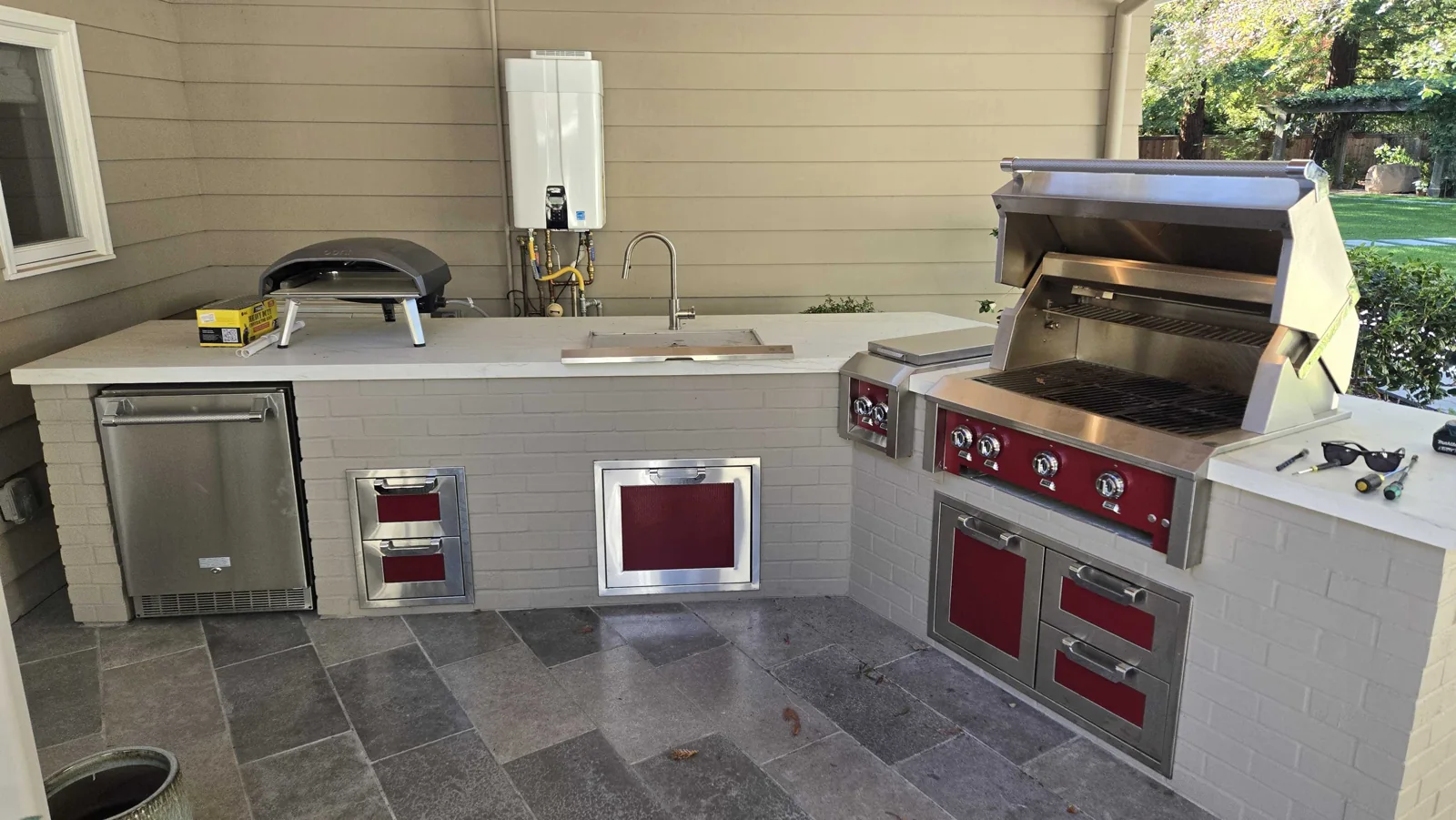 Outdoor kitchen with Hestan grill equipment.
