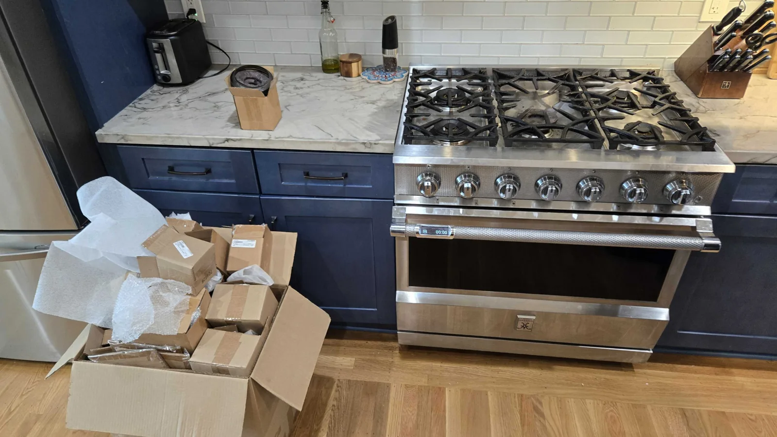 Hestan gas range with the cooking surface assembled.
