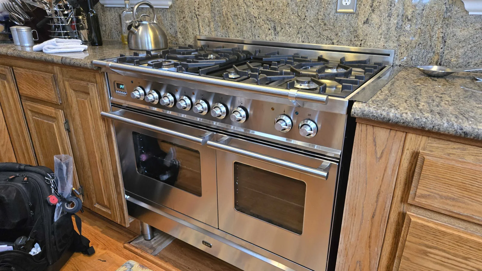 Stainless-steel ILVE range with two oven doors.