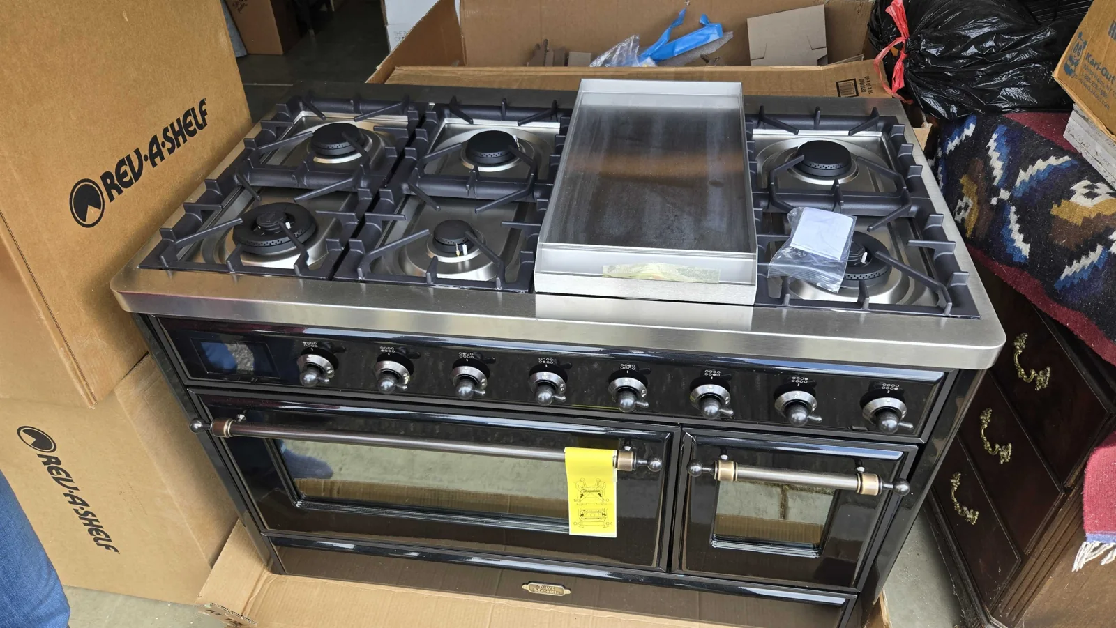 Black ILVE Majestic range with a central griddle.