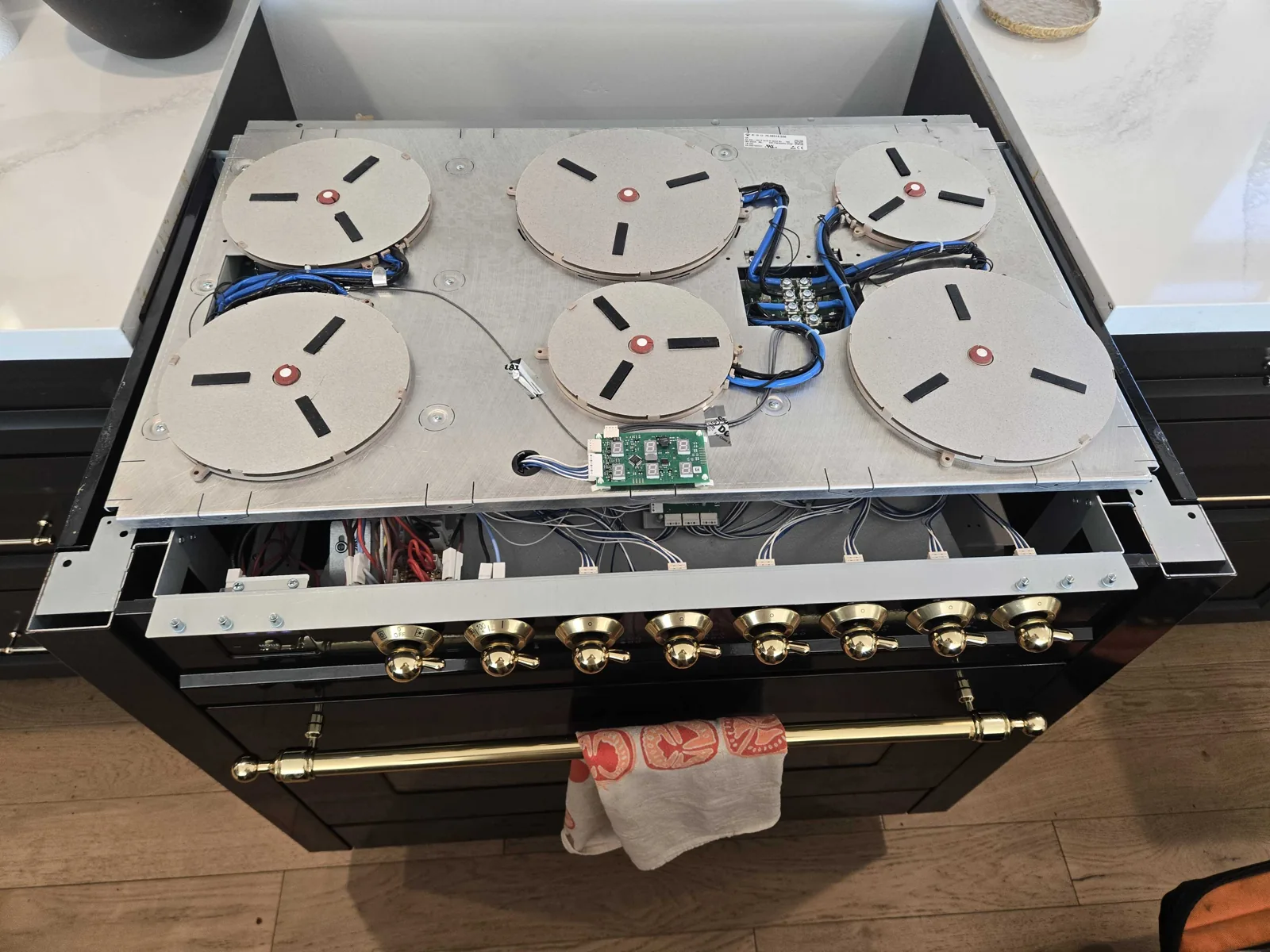 ILVE induction range with the glass surface removed during service.