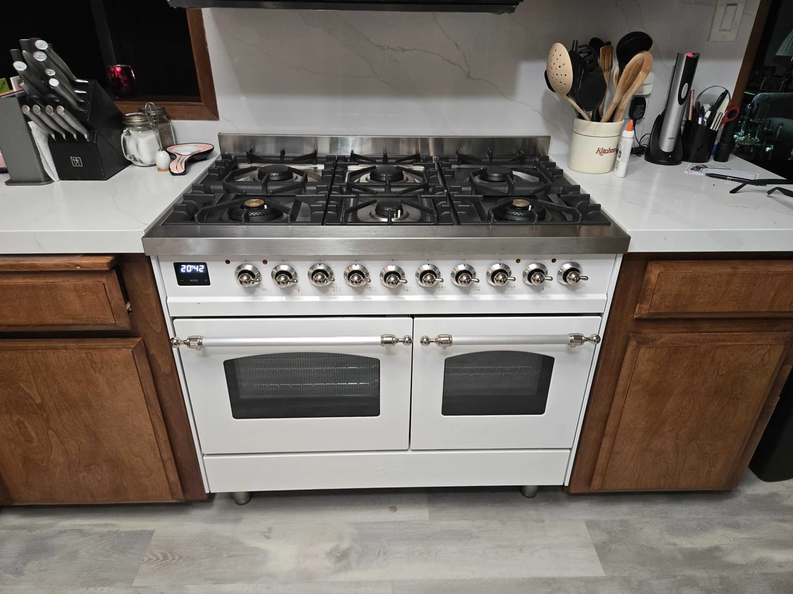 White ILVE gas range with two oven doors.