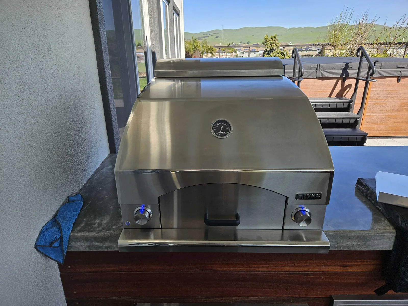 Built-in Lynx outdoor pizza oven with its door closed.