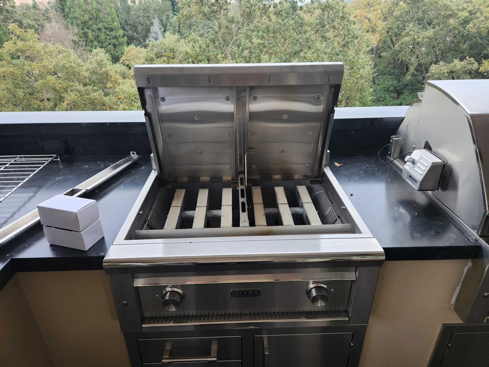 Lynx outdoor grill with the cooking grates removed during service.