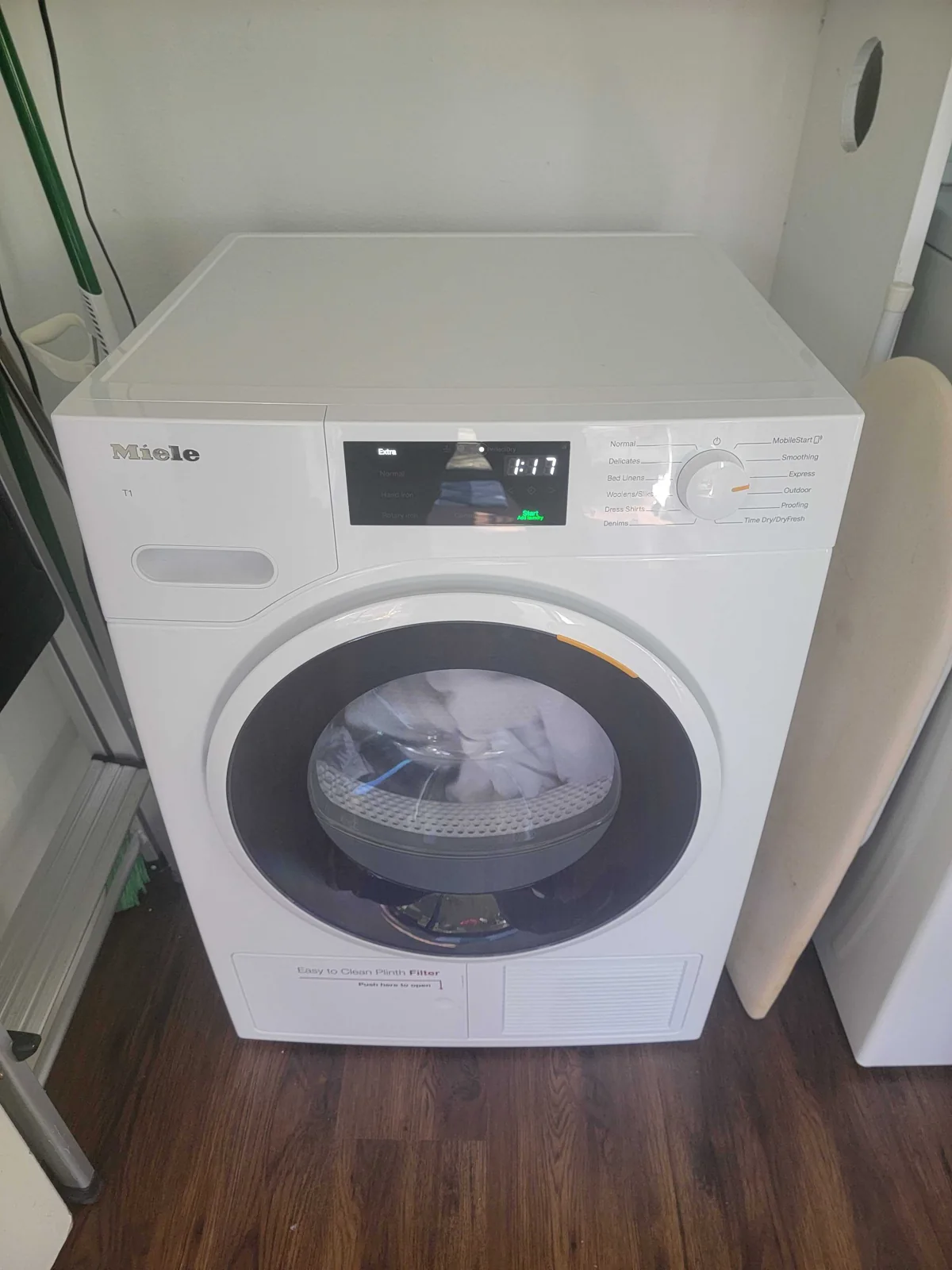 Front-loading Miele washer with its door closed.