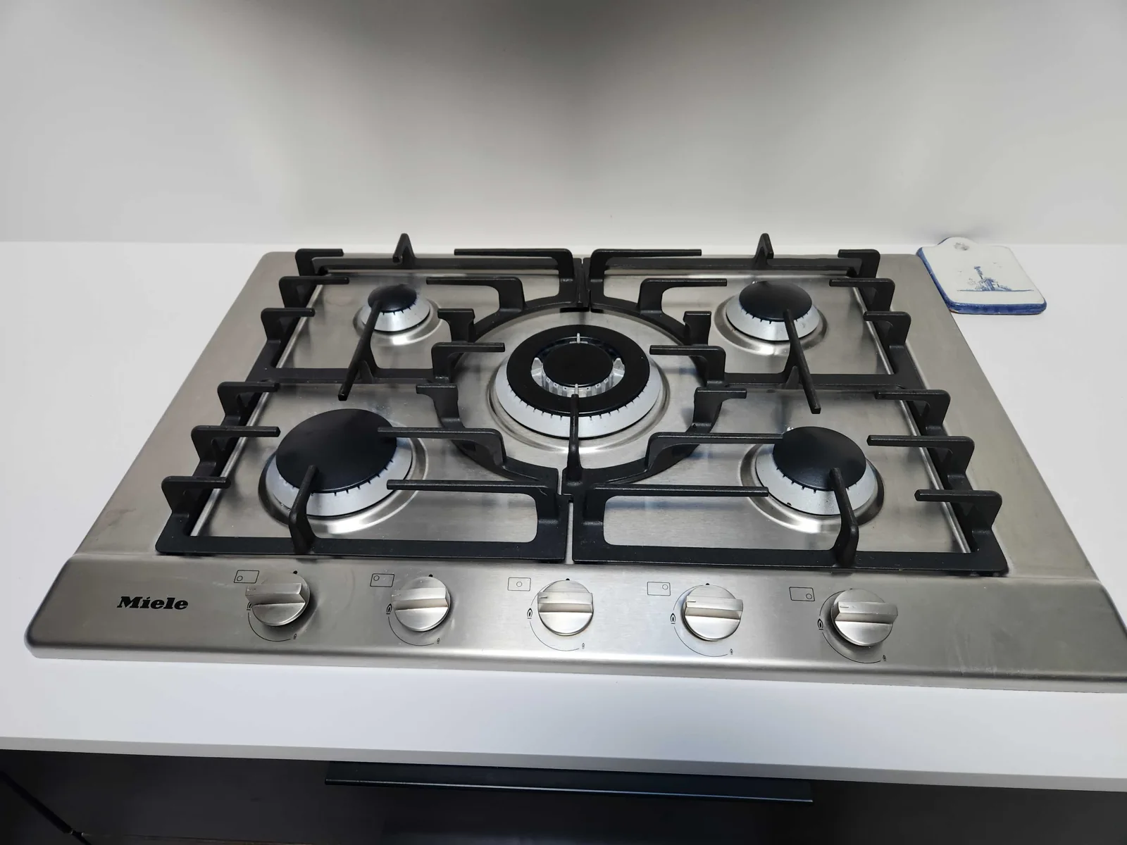 Miele gas cooktop with burner grates in place.