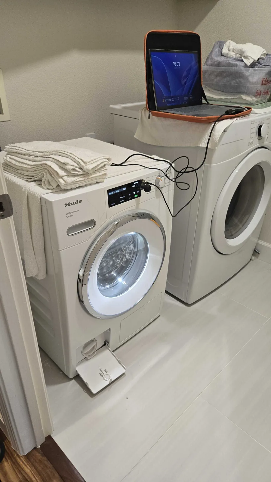 Miele W1 washer with diagnostic equipment connected.