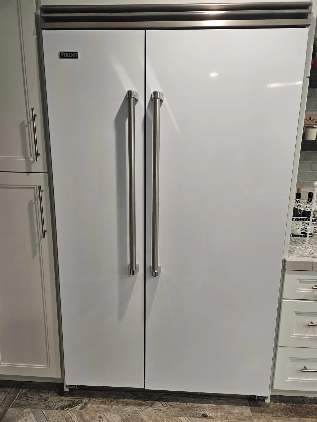 White Viking side-by-side refrigerator with the doors closed.