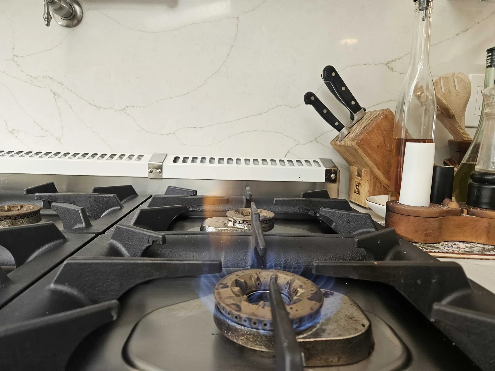 Viking gas burner with a visible blue flame.