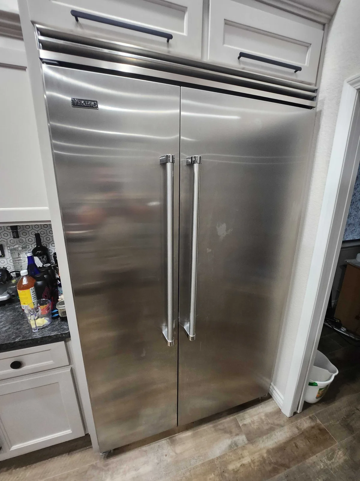 Built-in stainless-steel Viking refrigerator with two tall doors.