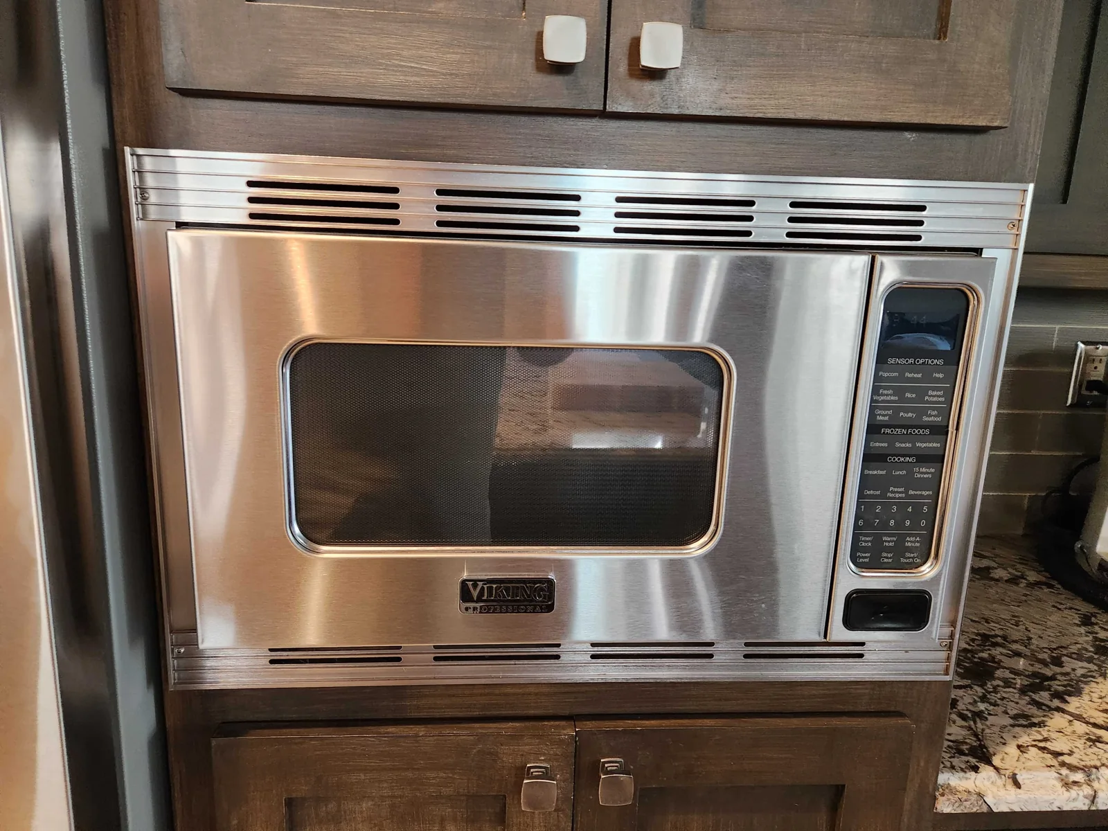Built-in Viking microwave in kitchen cabinetry.