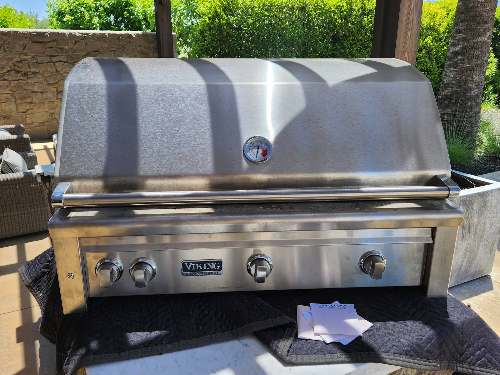 Built-in Viking outdoor grill with its hood closed.