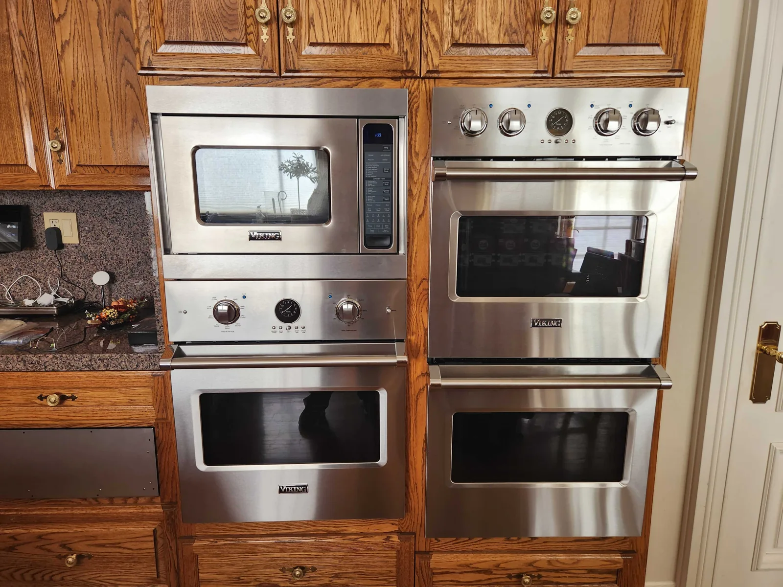 Built-in Viking microwave and wall ovens in wood cabinetry.