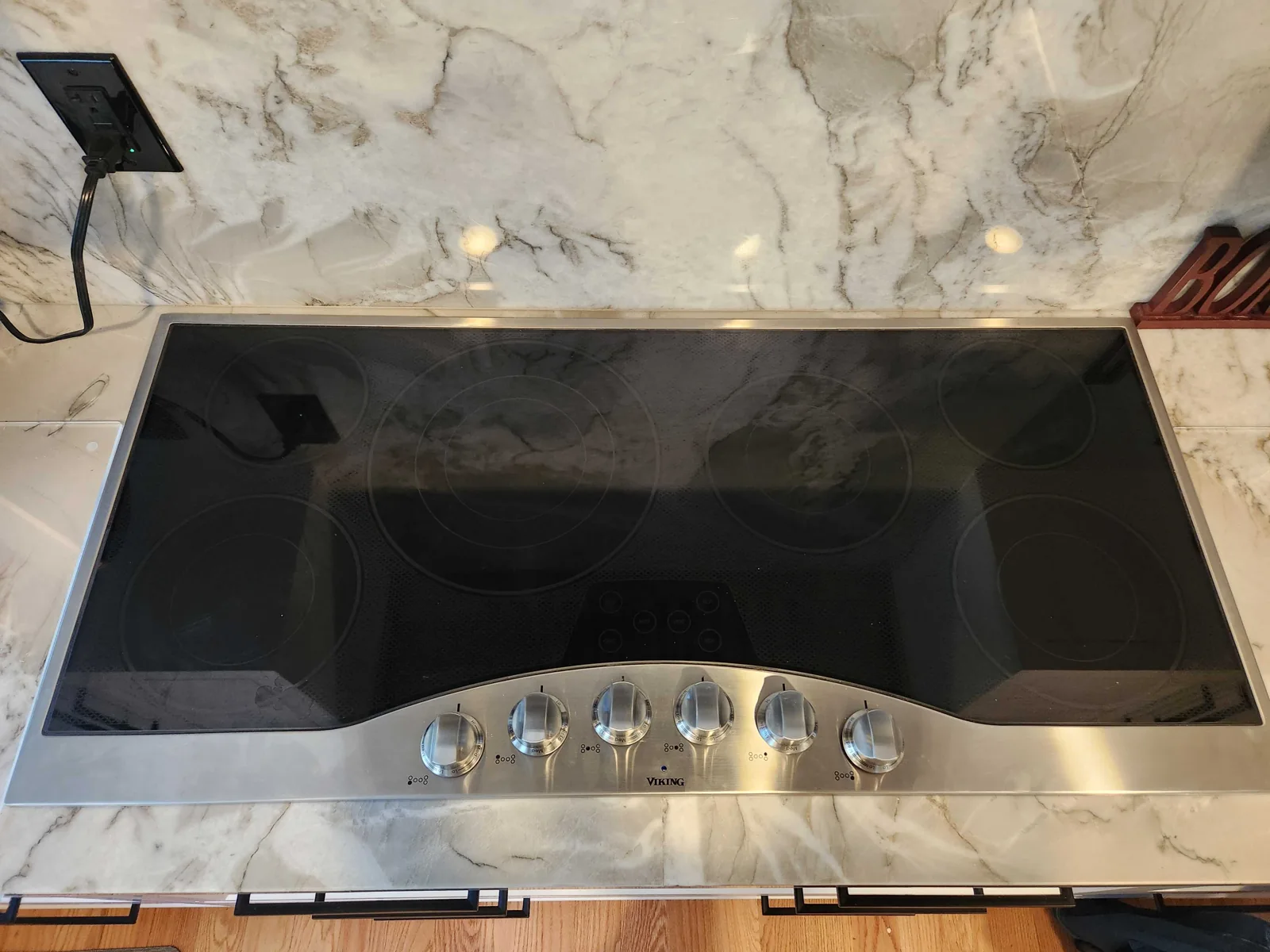 Viking glass cooking surface with front-mounted controls.